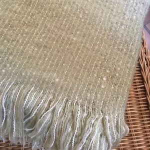 A beautifully woven must have blanket.